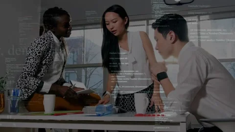Vertical video: Tapping tablet, three team members in office attire reviewing Stock Footage 330676331