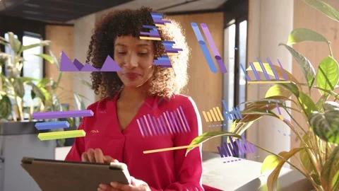 Vertical video: Tapping tablet, woman in red blouse reviewing data graphics at Stock Footage 333485573