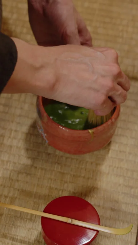 A vertical video of a tea expert preparing a cup of green tea matcha  Stock Footage 292991801
