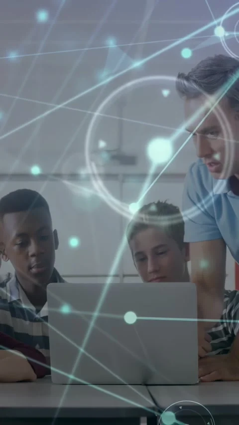 Vertical video: Teacher placing hand on laptop teaching class, network overlay Stock Footage 331270814