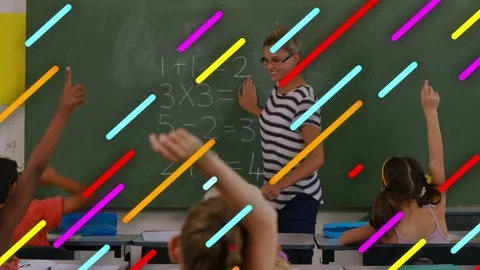 Vertical video: Teacher pointing at board, engaging students raising hands, Stock Footage 333998912