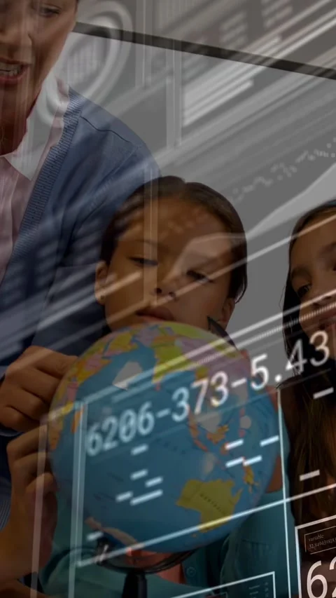 Vertical video: Teacher pointing guiding child turning globe for school while Stock Footage 334770516
