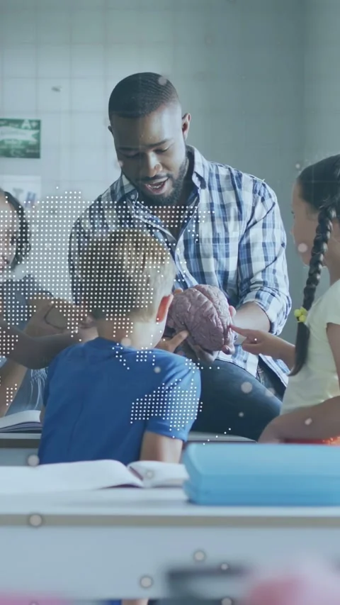 Vertical video: Teacher turning brain model guiding kids hands, dotted map or Stock Footage 333611043