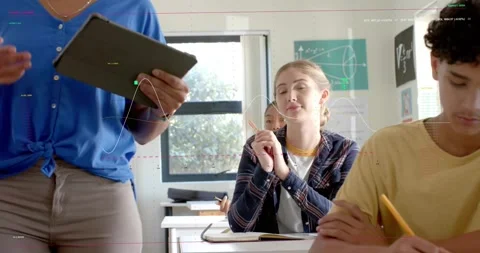 Vertical video: Teacher walking using tablet teaching math causing class writing Stock Footage 331024901
