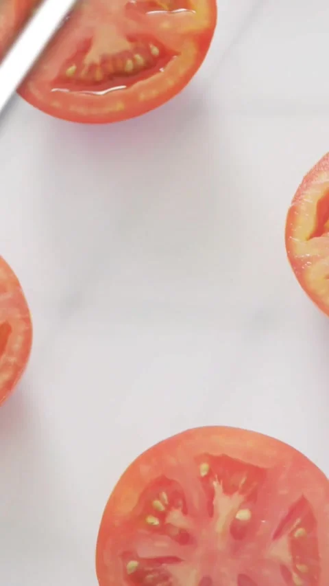 Vertical video: Teal bars rising, tomato half shifting while stripes sliding, Stock Footage 334187240