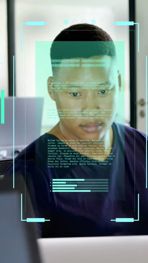 Vertical video: Teal HUD appearing, man in tech leaning in to laptop, reading Stock Footage 333181868