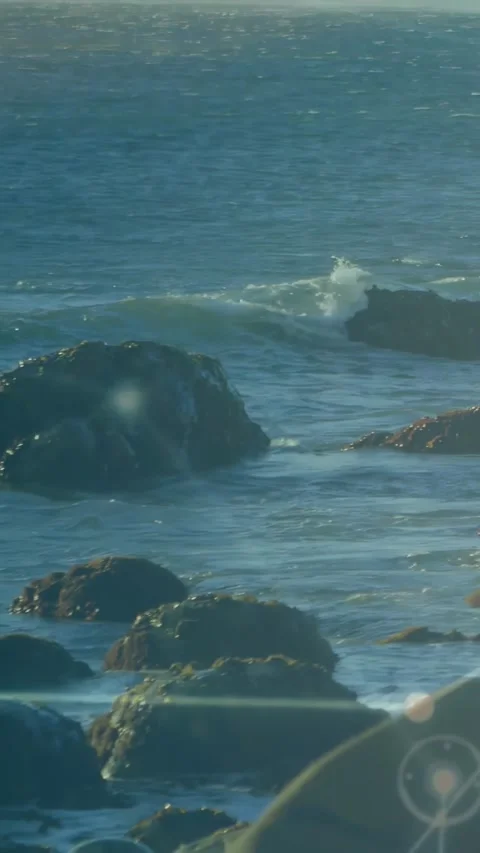 Vertical video: Teal overlay sweeping, camera shifting right, waves breaking, Stock Footage 334540369