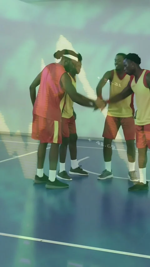 Vertical video: Team of 4 stacking hands starting sports play dribbling to hoop Stock Footage 333465361