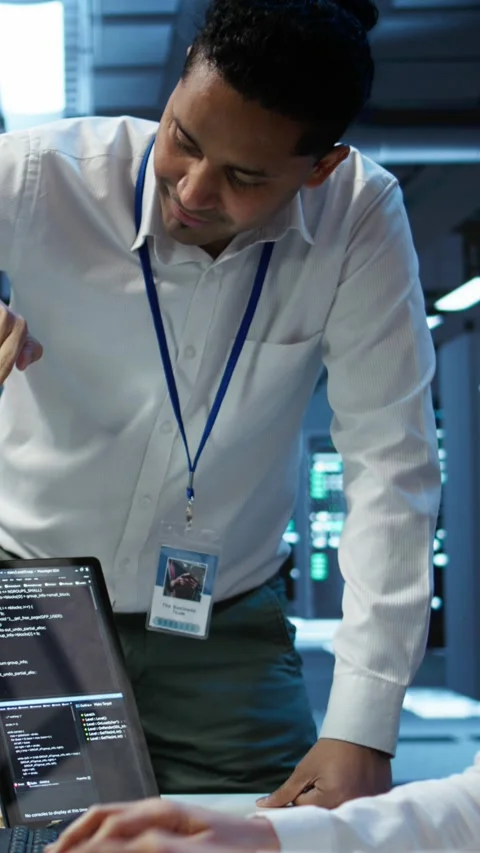 Vertical video Team of admins in data center ensuring system can handle Stock-Footage 280516138