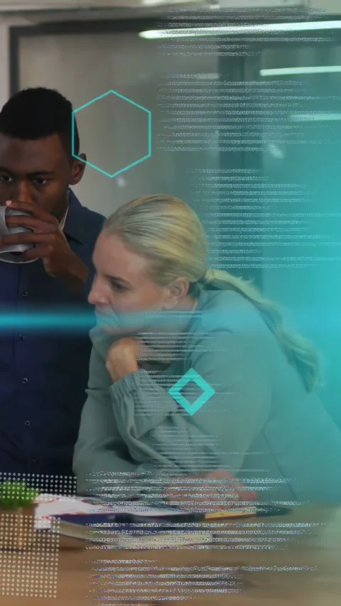 Vertical video: Team analyzing papers in tech meeting while teal code HUD Stock Footage 333658233