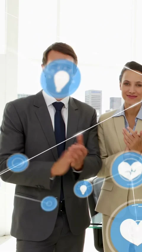 Vertical video: Team clapping in biz for launch, applause causing blue icons Stock Footage 334547284
