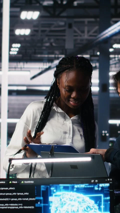 Vertical video Team of data center engineers using machine learning algorithms Stock-Footage 313455668