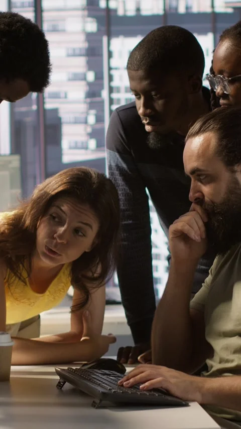 Vertical video Team of developers doing brainstorming, optimizing code Stock Footage 319486243