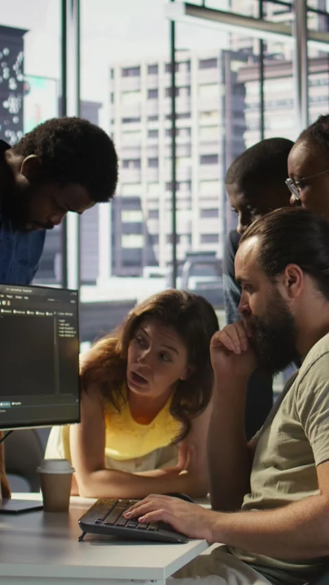 Vertical video Team of developers doing brainstorming, optimizing code Stock Footage 319487786