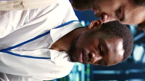 Vertical video Team doing data center components tests Stock Footage 245953659