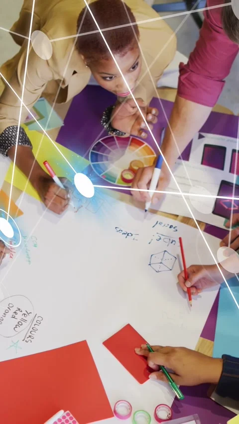 Vertical video: Team drawing on purple mat, starting overlay nodes when adding Stock Footage 335513820