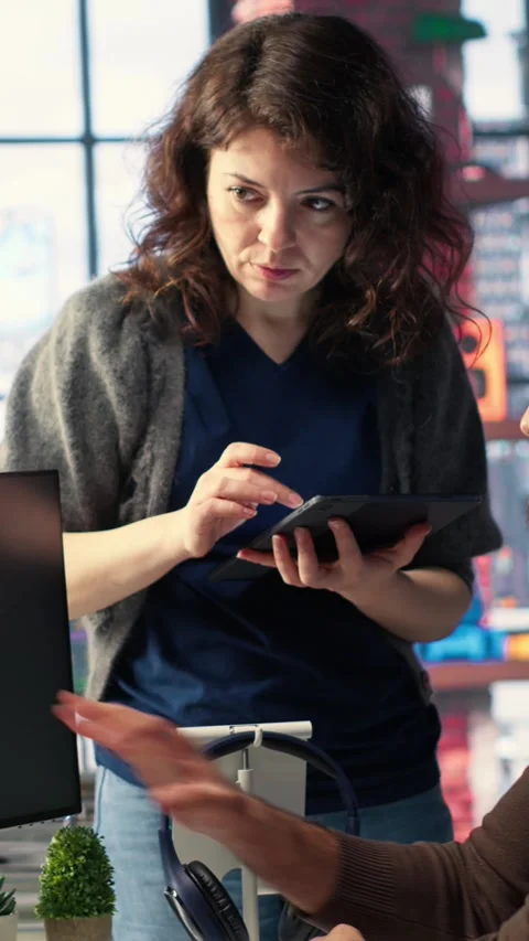 Vertical Video Team of experts work on social media content and video editing Stock Footage 308492201