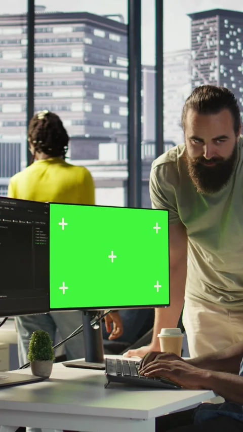 Vertical video Team of IT workers using green screen computer Stock Footage 319488886