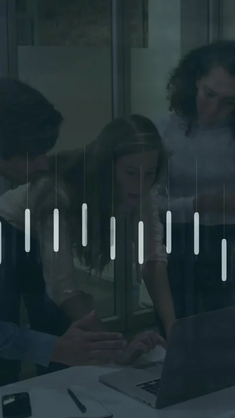 Vertical video: Team leaning over laptop, user using pad, animated chart overlay 動画素材 330655981