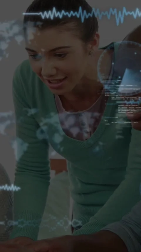 Vertical video: Team leaning, typing on laptop in tech hub, reviewing while map Stock Footage 331383222