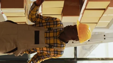Vertical video: Team of men working on inventory order in warehouse Stock Footage 232546547
