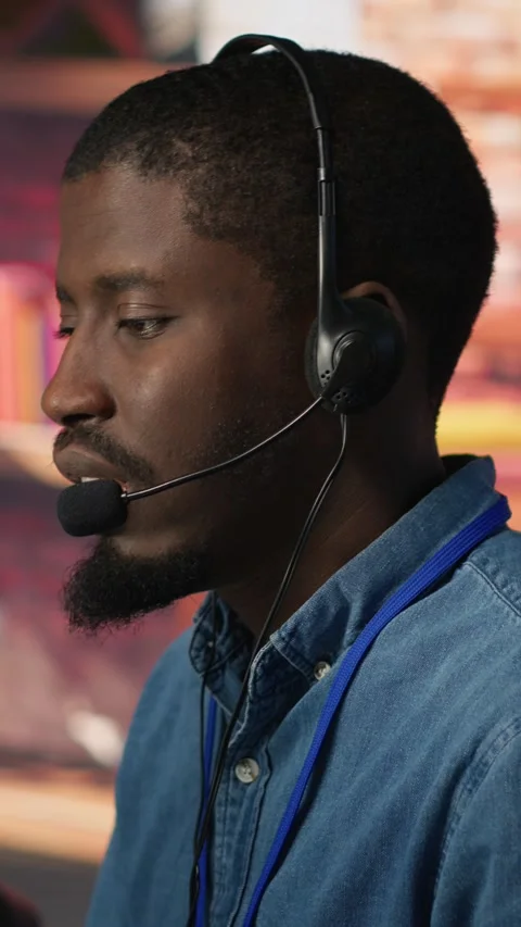 Vertical video Team of multiethnic call center agents in workplace helping Stock Footage 306061001