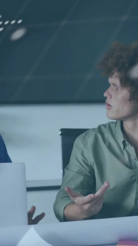 Vertical video: Team planning IT plan at table, laptop, dotted map and code Stock Footage 334386869