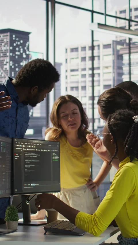 Vertical video Team of programmers fighting in office while checking code Stock Footage 319477971