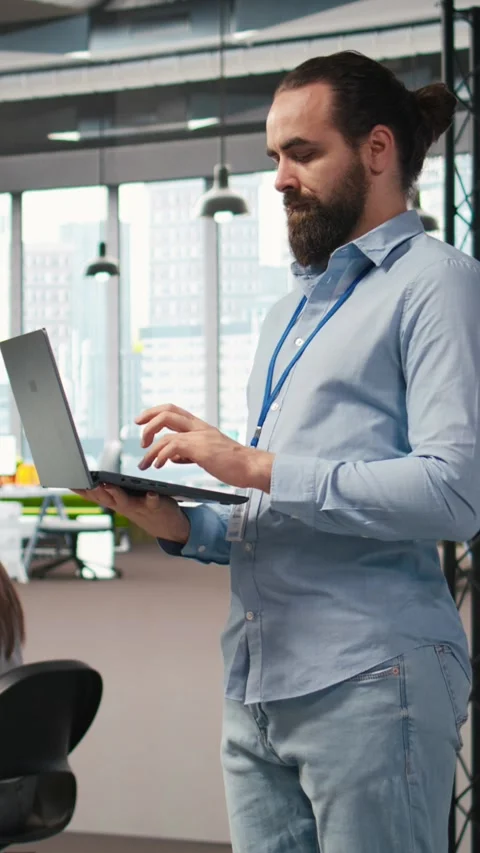 Vertical video Team of programmers in office developing software applications Stock Footage 312709237