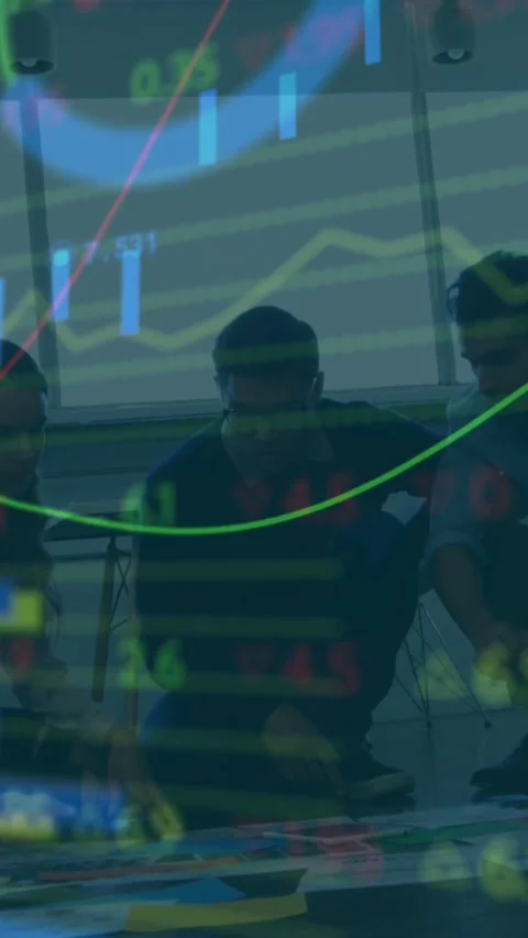 Vertical video: Team reacting to animating finance charts, leaning over table Stock Footage 334550413