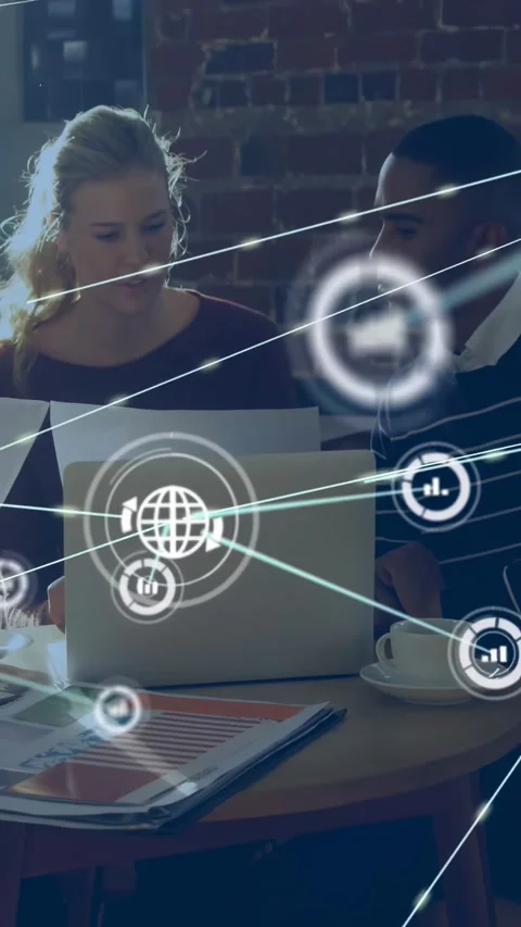 Vertical video: Team reading business charts, chat sparking data web over laptop Stock Footage 334598744