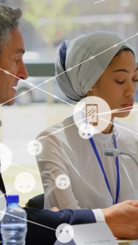 Vertical video: Team reading docs, man pointing causing phone or music or smiley Stock Footage 333109500