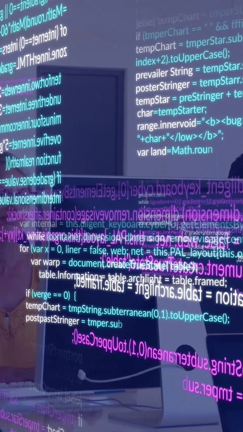 Vertical video: Team reviewing code in tech leaning in causing cyan magenta Stock Footage 330769430