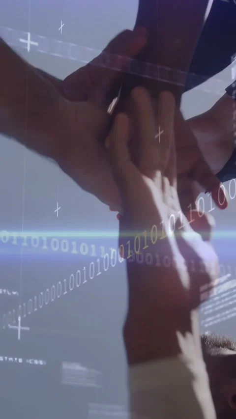 Vertical video: Team stacking hands, lifting palms, cheering, revealing sky with Stock Footage 330965926