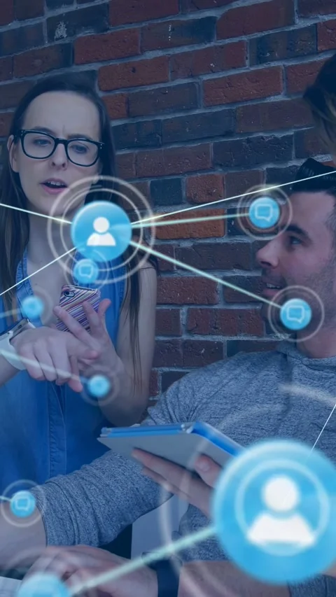 Vertical video: Team tapping tablet and pointing phone, expanding blue-node HUD Stock Footage 340133503