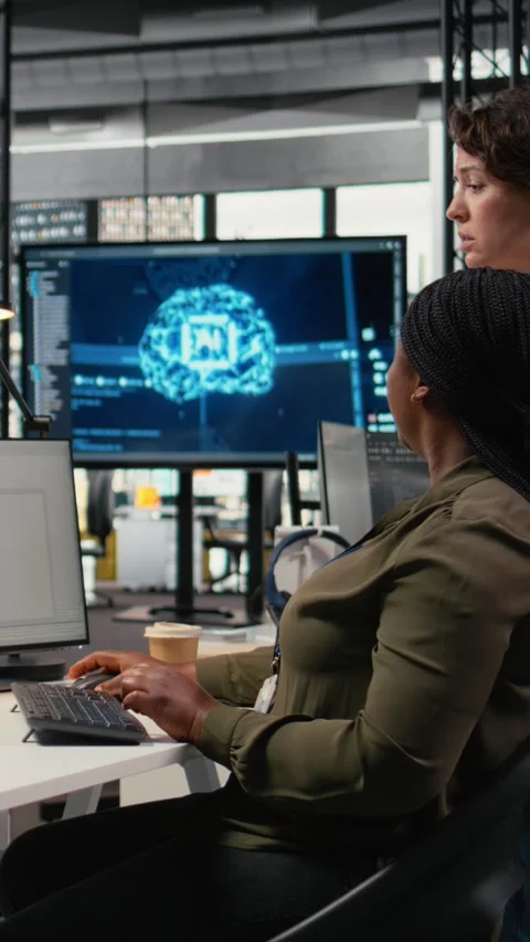 Vertical video Team of technicians in office working together, automating Stock Footage 323236787
