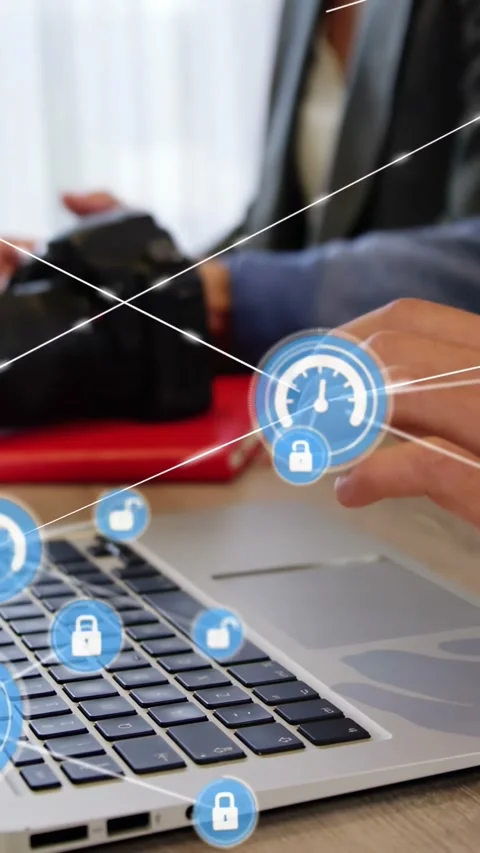 Vertical video: Team typing on laptop, causing security gauge lock HUD while Stock Footage 334540965