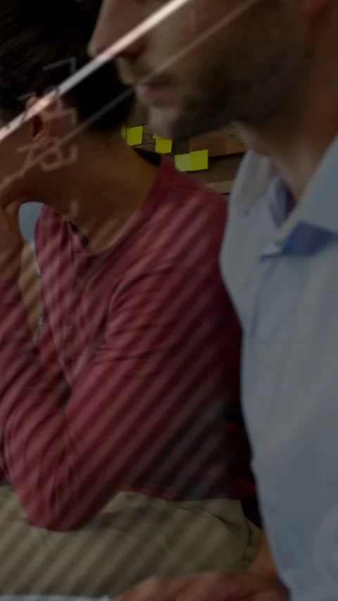 Vertical video: Team using laptop, speaker starting talk and charts appearing Stock Footage 333692232