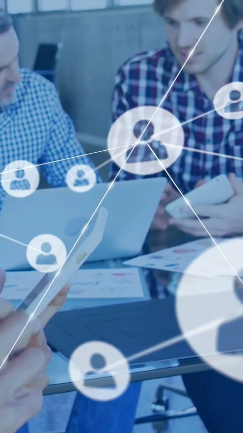 Vertical video: Team using tablet sparking network overlay expanding, linking Stock Footage 332317936