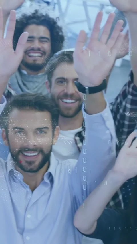 Vertical video: Team waving at camera in office while camera rising, red binary Stock Footage 334390800