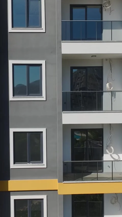 Vertical Video: Teams Operating on Metal Frames, Facades, and Stone Elements on Video stock 297751670