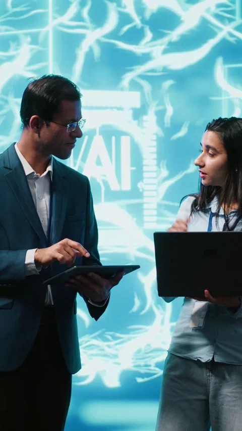 Vertical video Teamworking colleagues using AI neural networks modeled after Stock Footage 278374754