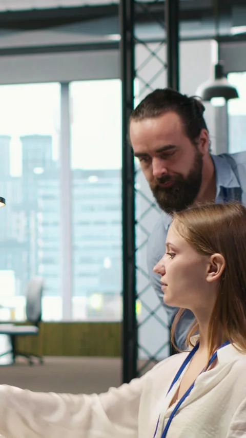 Vertical video Teamworking programmers developing software applications, working Stock-Footage 312709444