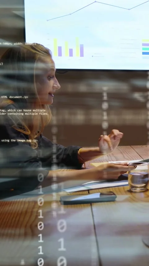 Vertical video: Tech analyst picking up tablet, initiating code overlay for data Stock Footage 333304177