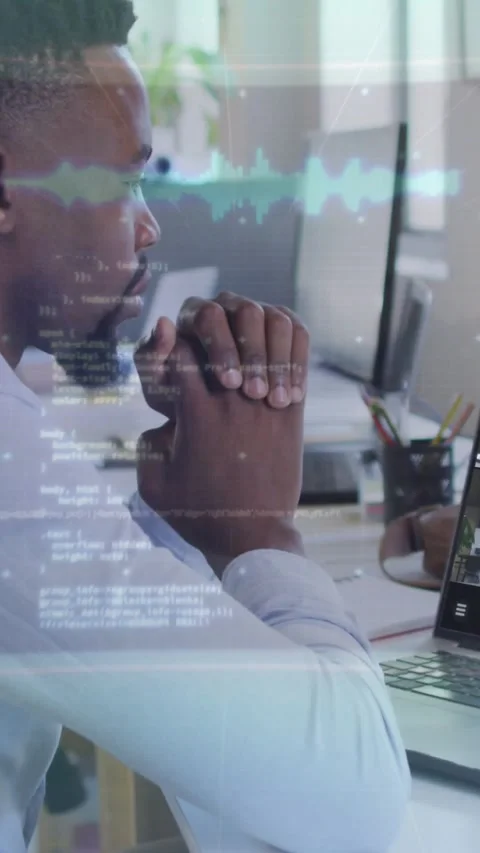 Vertical video: Tech analyst sitting scanning monitors as data overlays Stock Footage 330858516