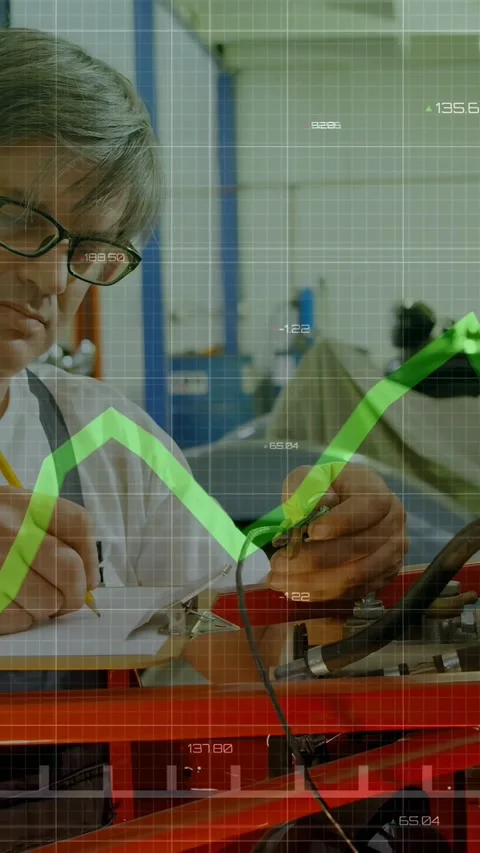 Vertical video: Tech clipping lead on red frame, causing green graph, noting Stock Footage 332806526