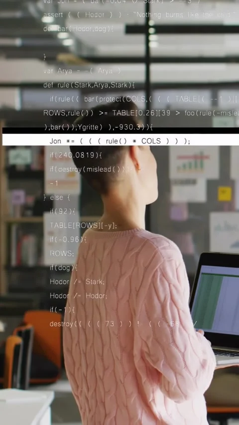 Vertical video: Tech dev glancing at passing peer checking chart with laptop Stock Footage 334604759