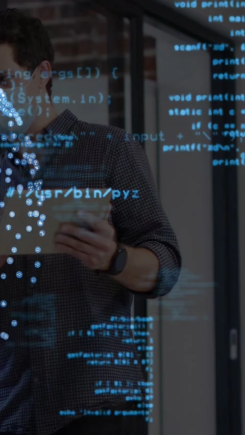 Vertical video: Tech dev holding tablet shifting it and causing blue code Stock Footage 333235979