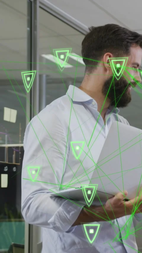 Vertical video: Tech dev turning toward off-screen call showing AR shields Stock Footage 333465502