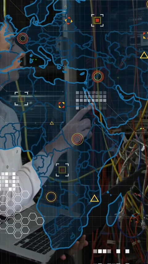 Vertical video: Tech holding laptop patching yellow cable AR map fading in Stock Footage 333487173